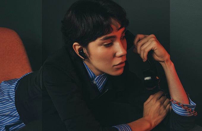 Person using CTRL8 CMT Ultra Pro true wireless earbuds with noise-cancelling for calls in black