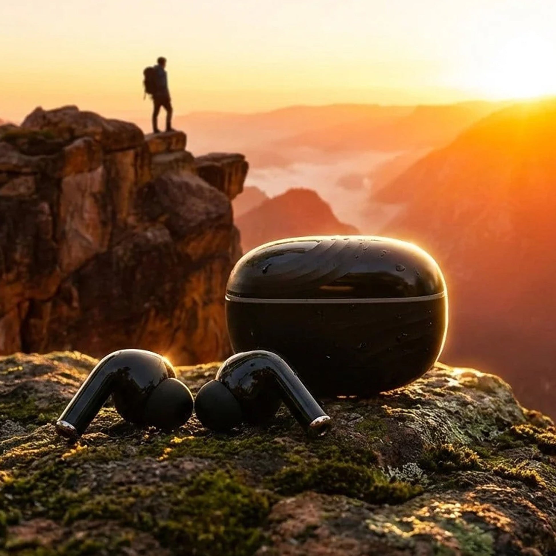 Explorer enjoying the sunset with CTRL8 true wireless earbuds in pure black, emphasizing deep bass and 48-hour playback