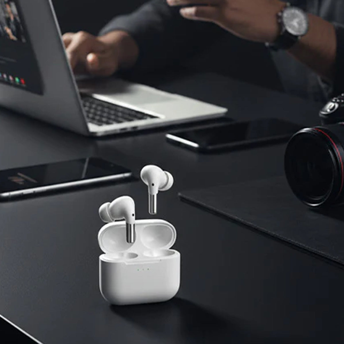 Professional using CTRL8 wireless gaming earbuds with mic for work and seamless connectivity