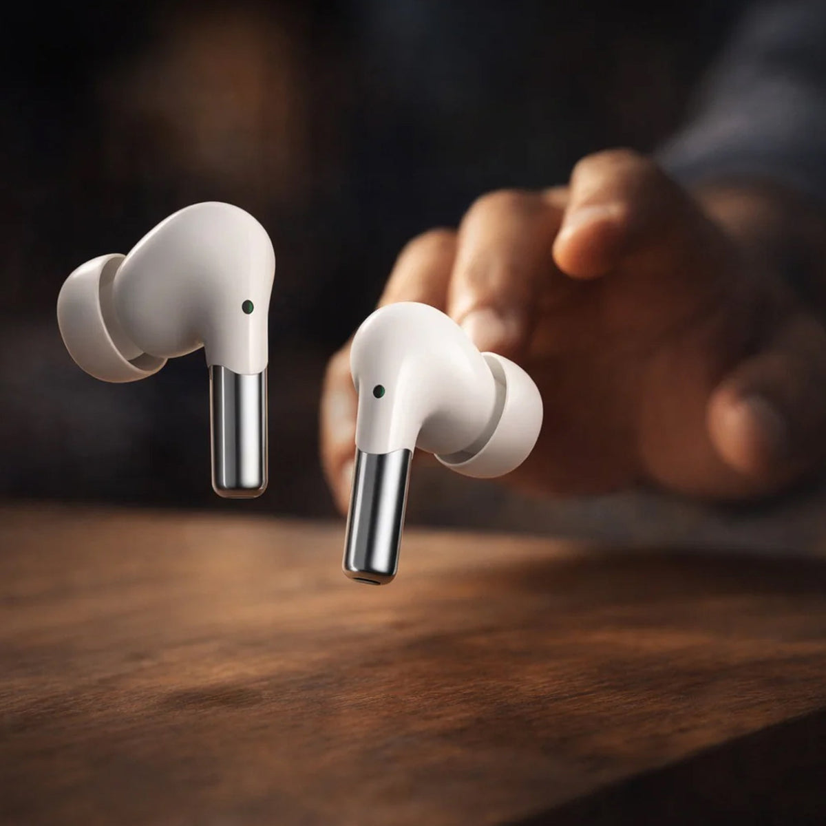 Gamer reaching for CTRL8 wireless gaming earbuds with mic, designed for low latency and immersive sound