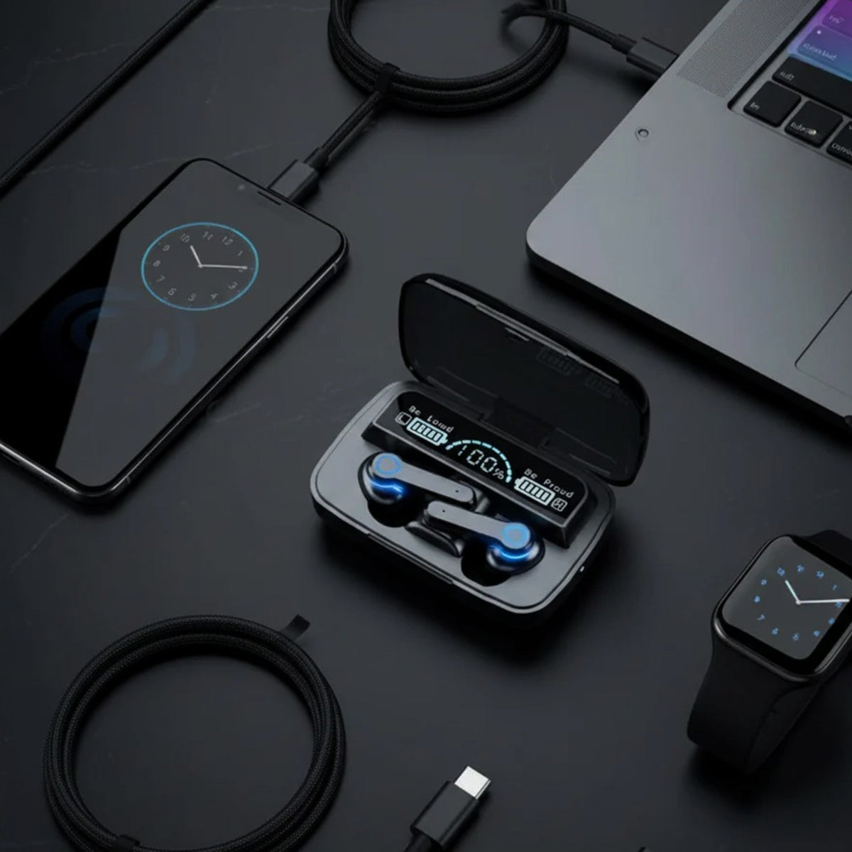 CTRL8 UltraBass M19 true wireless gaming earbuds with LED display placed alongside tech gadgets on a desk