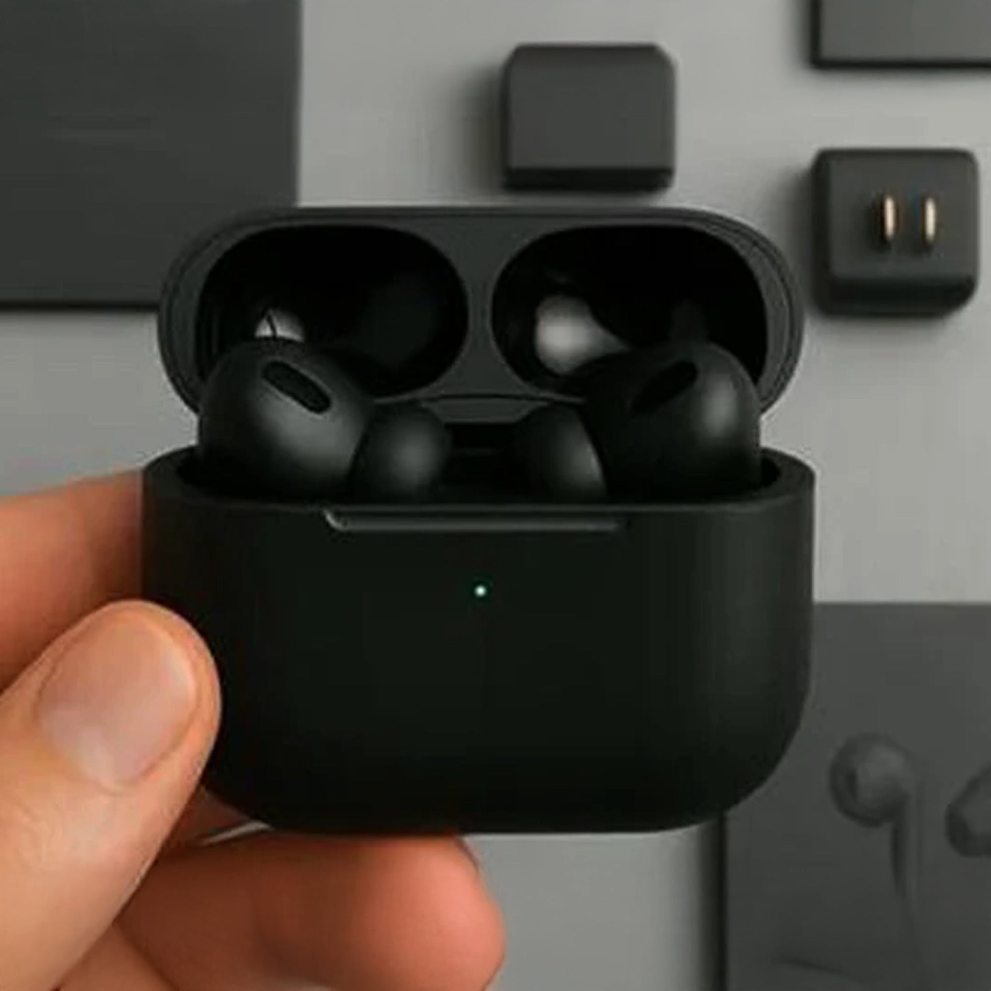 User holding CTRL8 Wireless Airpods Pro 2, showcasing sleek black design and portability
