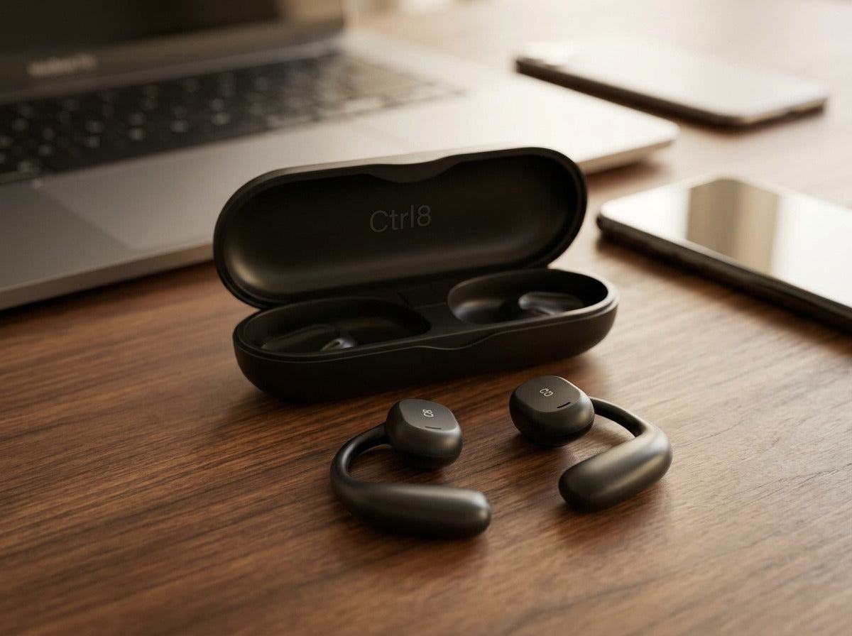CTRL8 X29 open-ear headphones with ergonomic design and charging case on a wooden desk