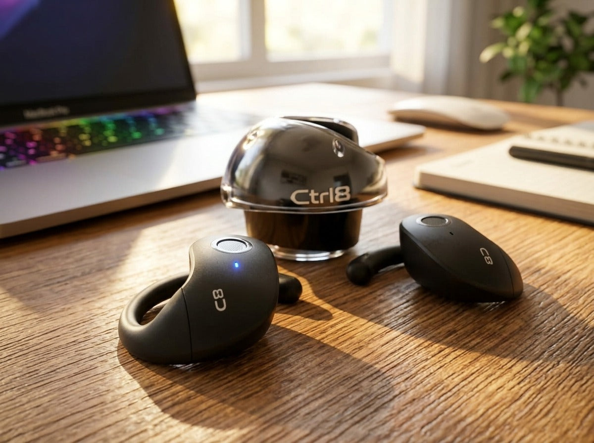 CTRL8 T2 over-the-ear earbuds with UNBLOQ technology and sleek design on a wooden desk